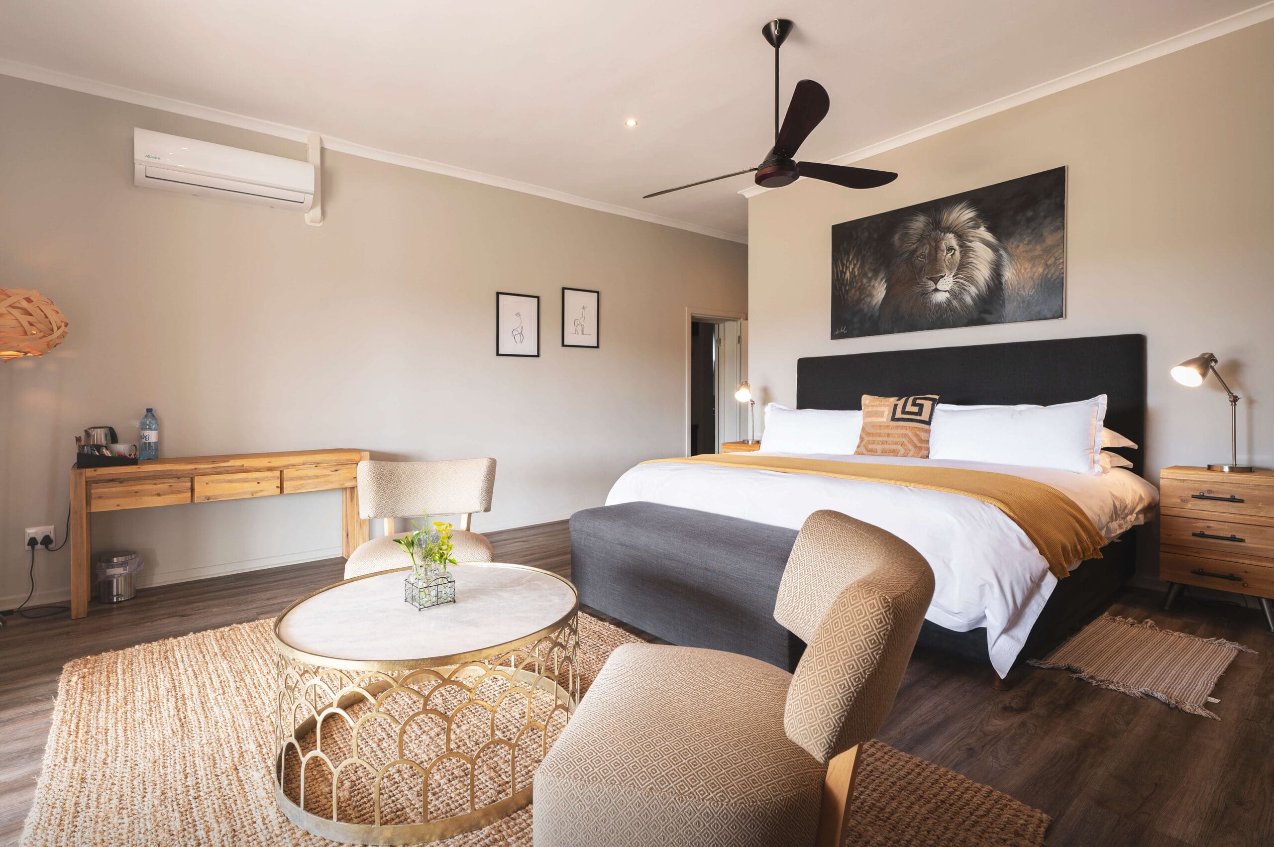 Luxurious accommodations: King-size bed and sitting area in a Ubuninzi suite.