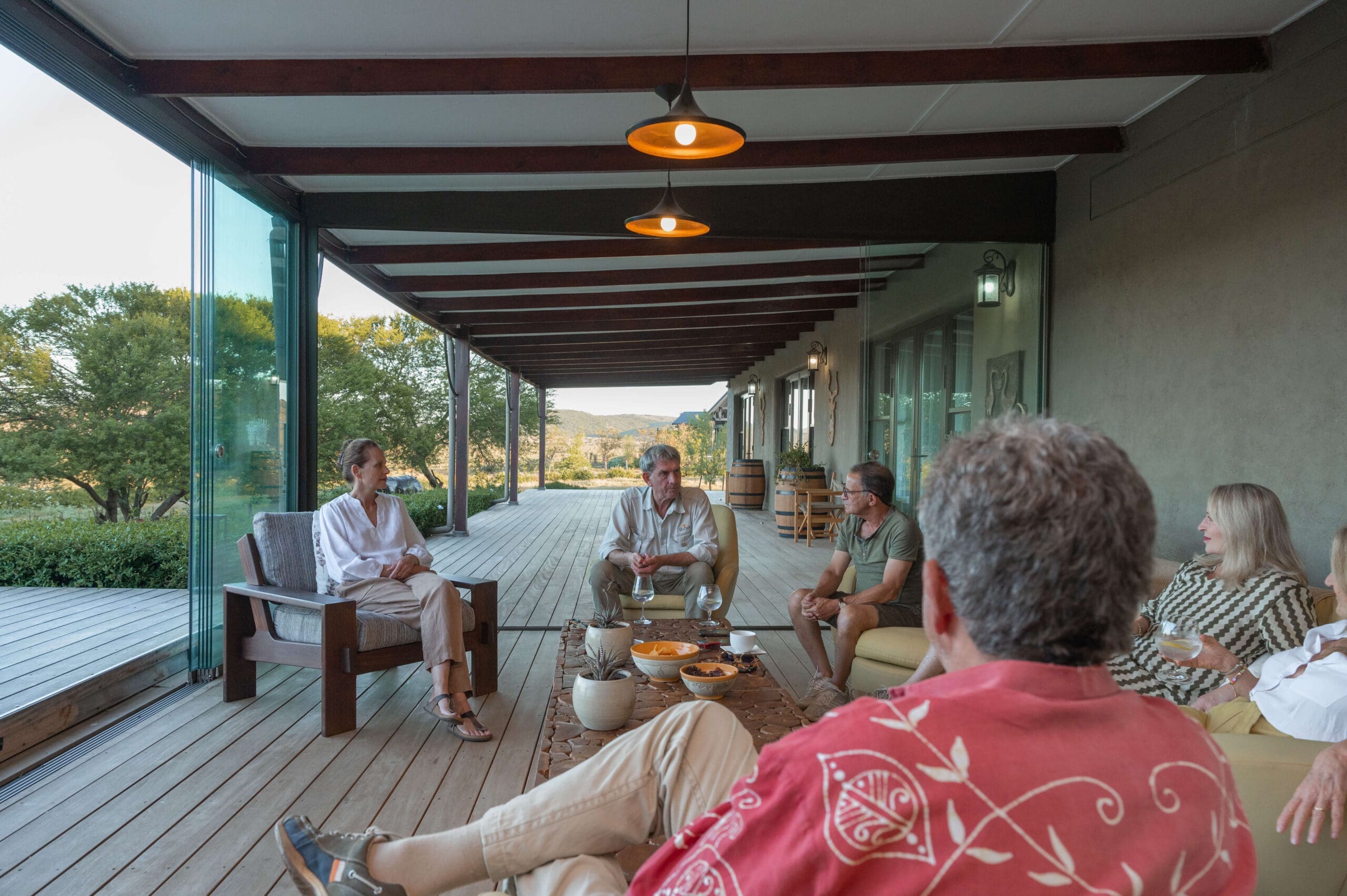 Guests enjoying drinks and conversation on the Ubuninzi patio.